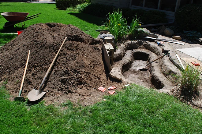 Pond and waterfall backyard project under construction