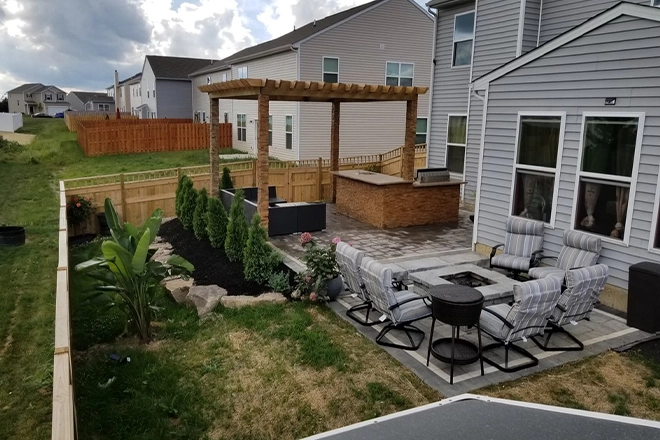 Large patio with pergola and separate seating areas Large patio with pergola and separate seating areas