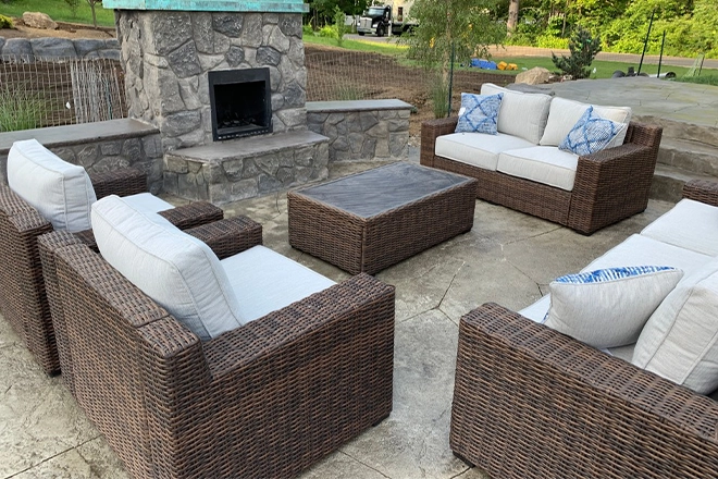 Patio hardscape with fireplace and furniture Patio hardscape with fireplace and furniture