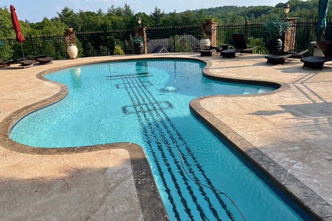 Pool deck around a guitar shaped pool Pool deck around a guitar shaped pool