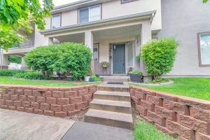 Retaining wall materials helping define a front yard pathway