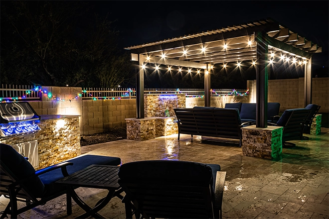 Pergola on a patio at night with lights