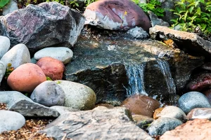 Small backyard water feature waterfall and rocks