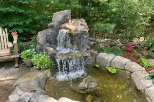 Water features include raised ponds with a waterfall